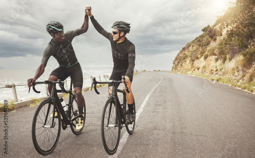 Fotografie, Tablou Bike, friends and men high five on road having fun cycling together outdoors
