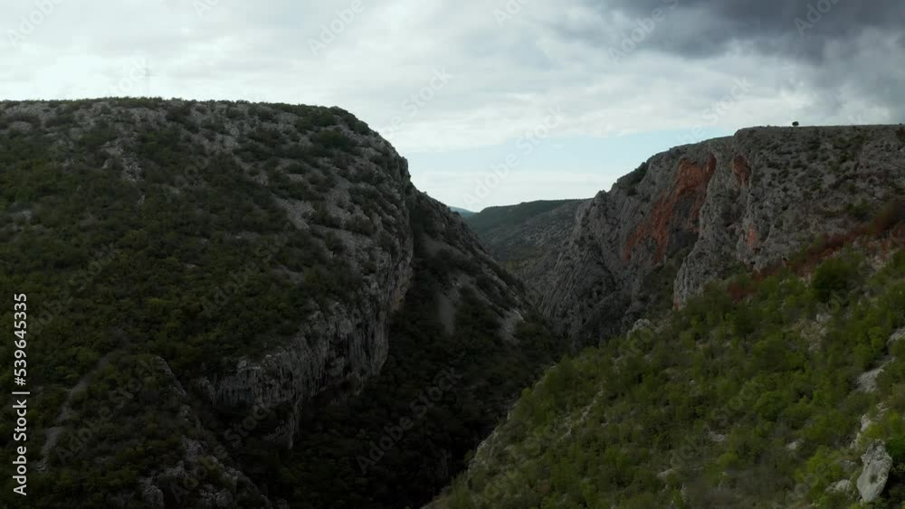 Rocky mountains in the area of Sibenik are a stunning natural wonder in Croatia, known for their dramatic landscapes and lush vegetation. Aerial footage shows off the mountains' stunning landscape Rocky mountains in the area of Sibenik are a stunning natural wonder in Croatia, known for their dramatic landscapes and lush vegetation. Aerial footage shows off the mountains' stunning landscape