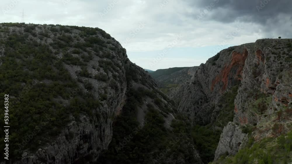 Rocky mountains in the area of Sibenik are a stunning natural wonder in Croatia, known for their dramatic landscapes and lush vegetation. Aerial footage shows off the mountains' stunning landscape Rocky mountains in the area of Sibenik are a stunning natural wonder in Croatia, known for their dramatic landscapes and lush vegetation. Aerial footage shows off the mountains' stunning landscape