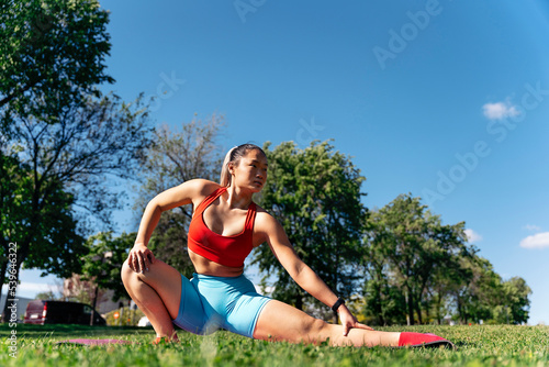 Asian Woman Stretching After Training