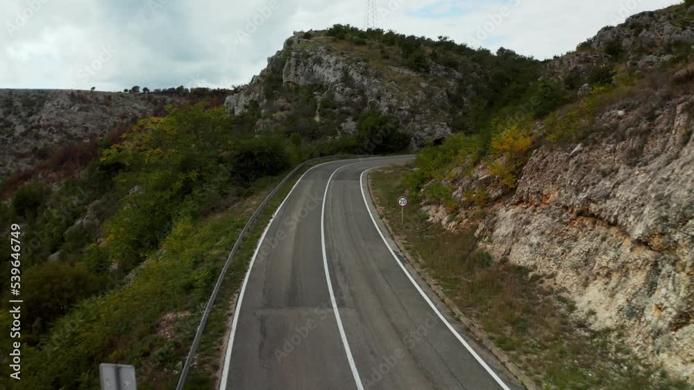 Mountain road Croatia. Rocky mountains in the area of Sibenik are a stunning natural wonder in Croatia, known for their dramatic landscapes and lush vegetation. Mountain road Croatia. Rocky mountains in the area of Sibenik are a stunning natural wonder in Croatia, known for their dramatic landscapes and lush vegetation.
