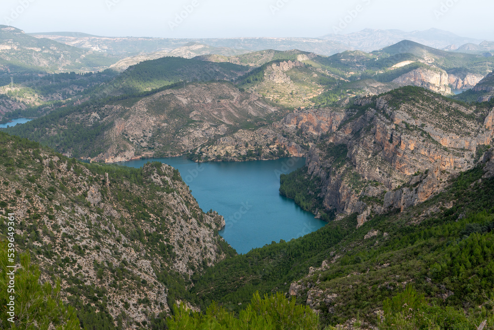 Beautiful landscape photo with the mountains surrounding the reservoir of cortes del pallas, Valencian community, Spain