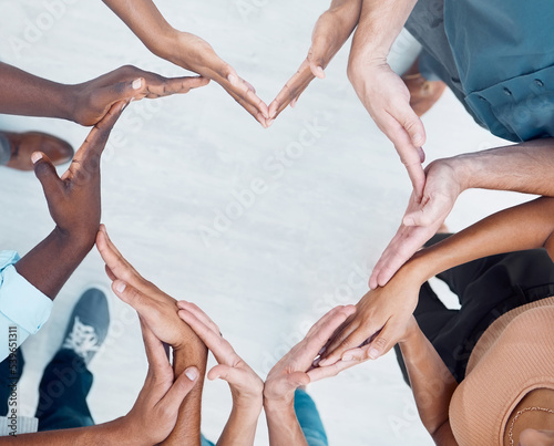 Teamwork hands, heart and diversity partnership, business people support or community care, motivation and trust. Above group team building for charity, kindness and global solidarity, love and hope photo