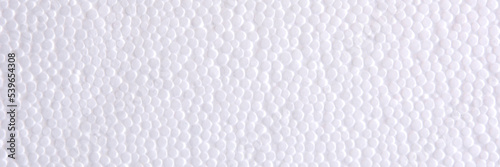 Panoramic header banner of White Polystyrene or styrofoam texture background. Styrofoam board for backdrop. Copyspace for text. Selective focus. © Vlyaks