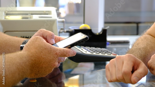 Man buying gold on jewellry shop