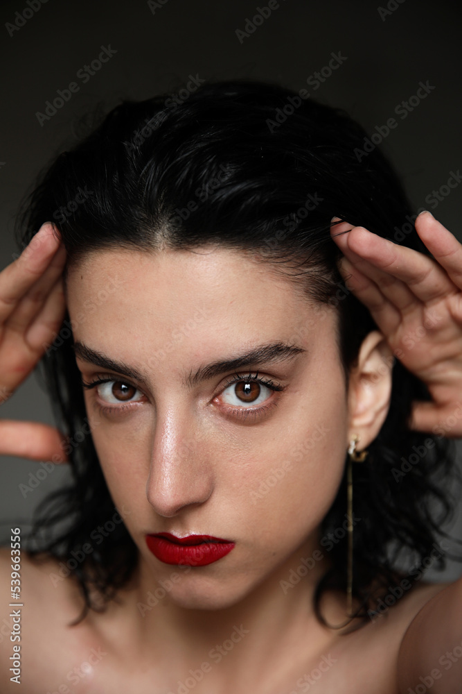 Young woman with strong face expression, looking at the camera. Mental issues. Young woman with strong face expression, looking at the camera. Mental issues.