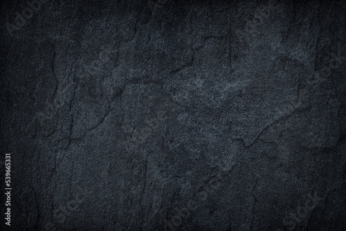 dark gray stone or black slate stone background or texture