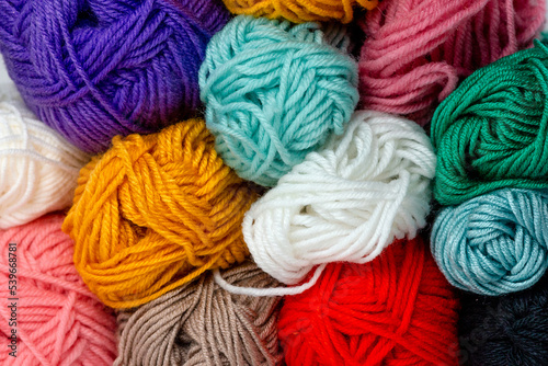Collection of colorful skeins of threads from above. Horizontal format. For handmade, hobby and craft.