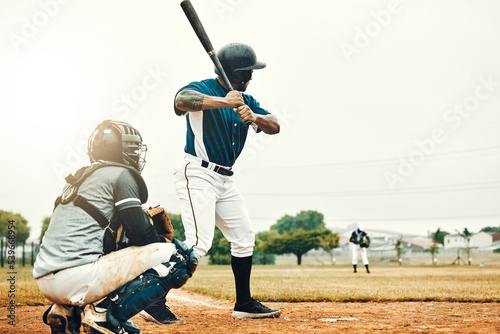 Baseball man, team training game and baseball player baseball bat to hit softball ball on pitch. Professional USA athlete, focus and motivation on sport field for fitness workout on stadium ground photo