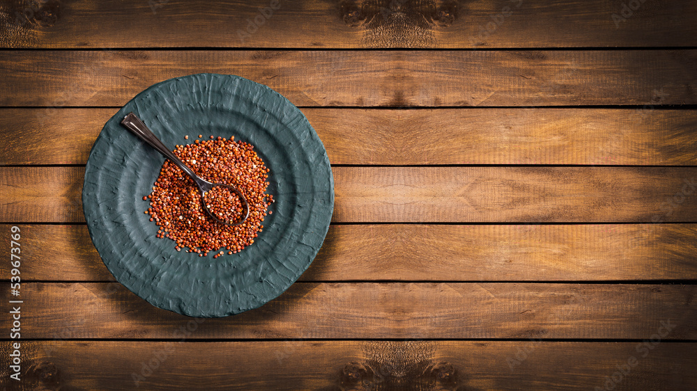 Chenopodium quinoa - Red quinoa seeds in bowl Chenopodium quinoa - Red quinoa seeds in bowl