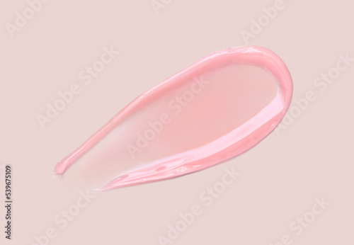 cosmetic smear of balm mask gel on beige background