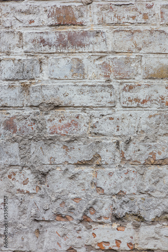 Old brick wall painted with white paint