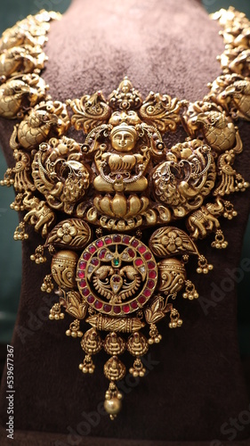 Bangalore, India 4th May 2022: Indian customer in a jewellery exhibition buying gold on the occasion of Dhanteras and Vijayalaxmi. Traditional ornaments with marvelous stones and intricate designs.