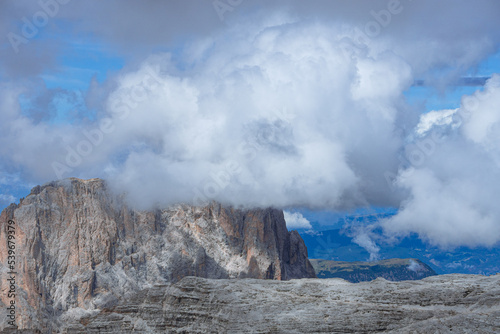 The landscape of the Dolomites seen from the Sella group: one of the most famous and spectacular mountain massifs in the Alps, near the town of Canazei, Italy - July 2022.
