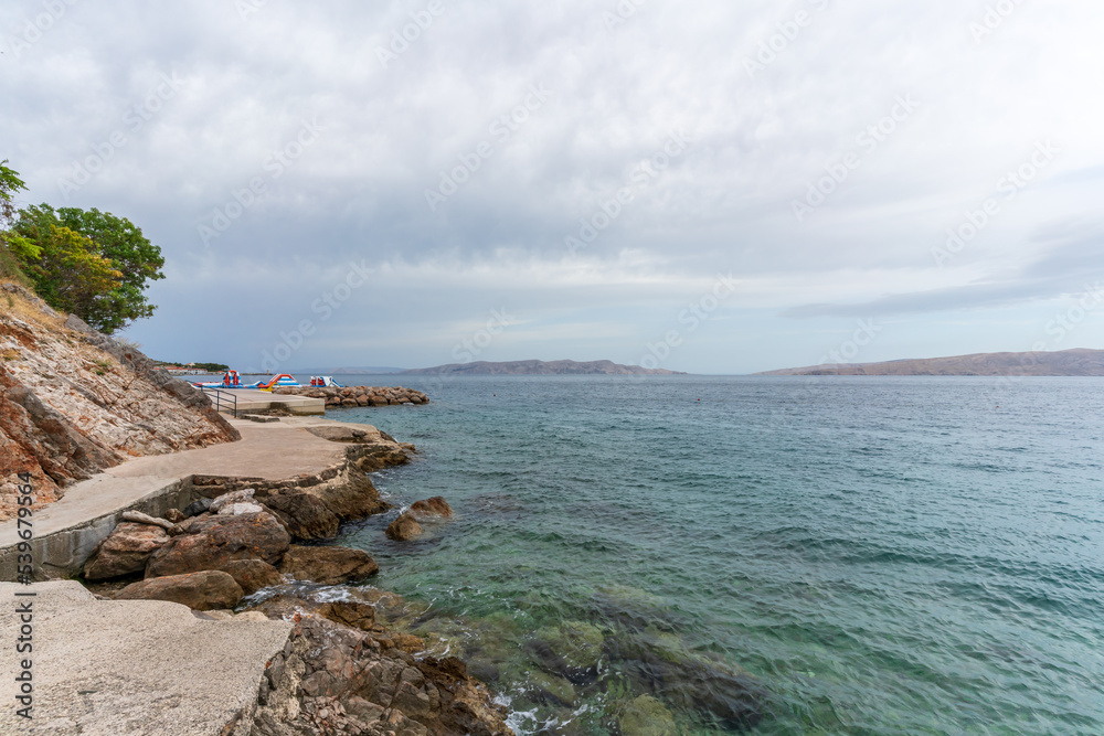 Coastal section in Senj with view of Krk Coastal section in Senj with view of Krk