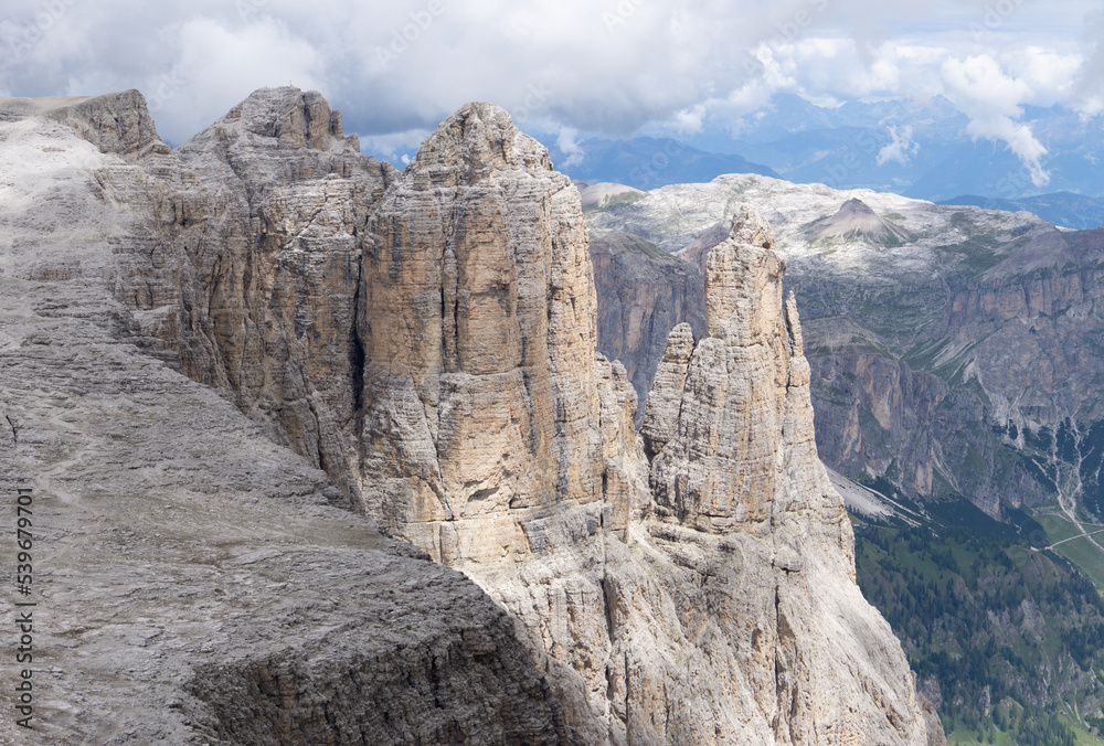 The landscape of the Dolomites seen from the Sella group: one of the most famous and spectacular mountain massifs in the Alps, near the town of Canazei, Italy - July 2022.