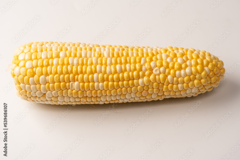 Yellow sweet corn isolated on white background. Copyspace. Yellow sweet corn isolated on white background. Copyspace.