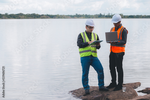 Environmental engineers work at wastewater treatment plants,Water supply engineering working at Water recycling plant for reuse,Technicians and engineers discuss work together.