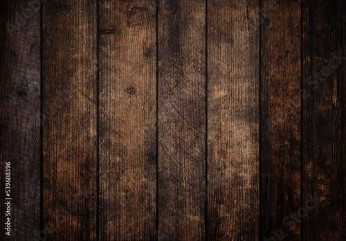 Dark grunge old wood planks background, vignette wooden texture
