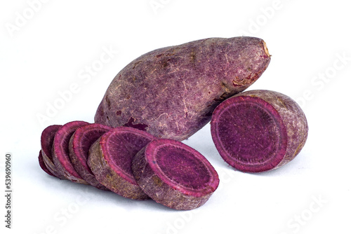 purple sweet potato with sweet potato sliced on white background