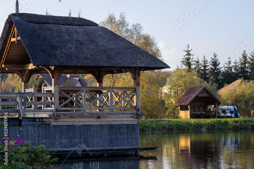 Wooden house on the lake © Tomasz