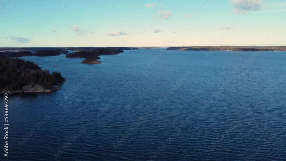 Wavy blue water and islands in Baltic Sea archipelago, aerial push-in Wavy blue water and islands in Baltic Sea archipelago, aerial push-in