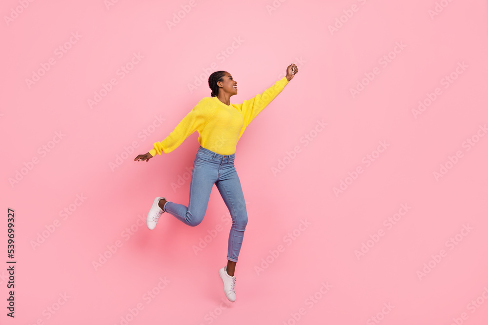 Full size profile side photo of young pretty girl jumper try to catch parasol isolated over pink color background