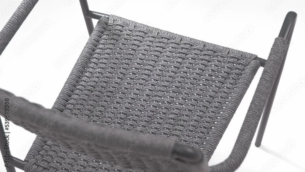 Designer gray chaise longue chair with weaving of gray woolen threads on a white background. Isolated