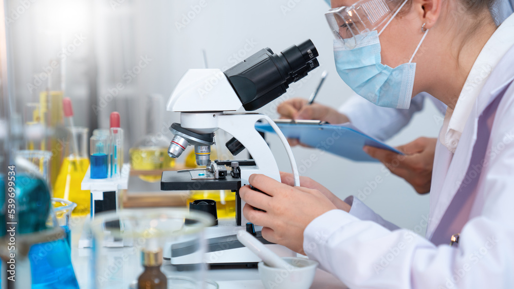 Scientist or researchers working in science laboratory, medical technology research work, science laboratory research and development concept. Scientist or researchers working in science laboratory, medical technology research work, science laboratory research and development concept.