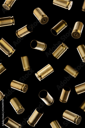 Obraz na plátně Many Pistol bullet casings isolated on black background