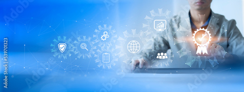 ISO Certification of standards quality control assurance business technology concept. Businessman touching virtual screen iso certification icon to guarantee.