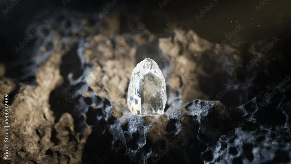 Raw crystal or diamond on the rocks in a dark cave. Shiny rough uncut gem.