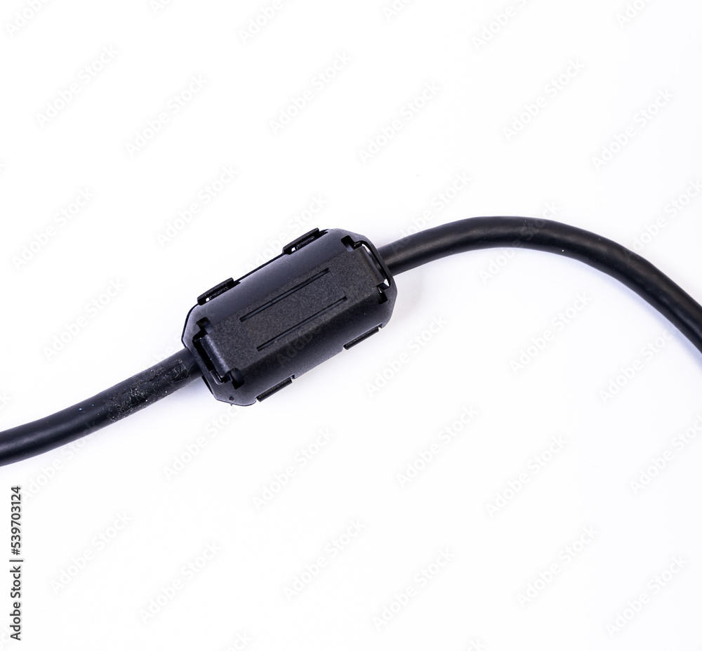 Close up of a ferrite bead inductor on cable on isolated white Close up of a ferrite bead inductor on cable on isolated white