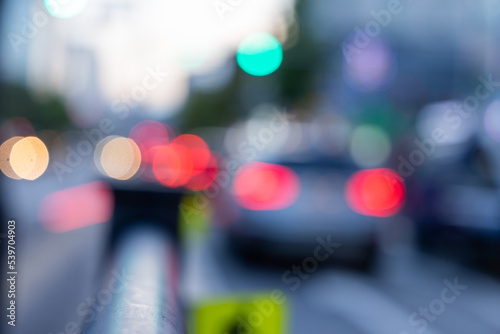Blurred view of Seoul street with shops, roads, cars and buildings. Can be used as background. De focused image of capital of south Korea.