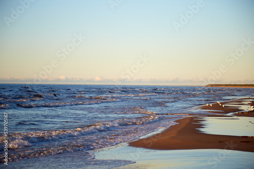 Beautiful view on a wavy sea an wonderful sandy beach  selective focus