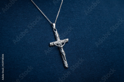 Silver necklace on blue background jewelry fashion 