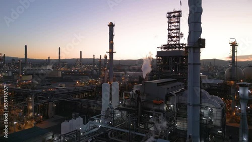 Refinery producing Gasoline as smoke pollutes the air at dusk, Shell Refinery, Martinez California photo