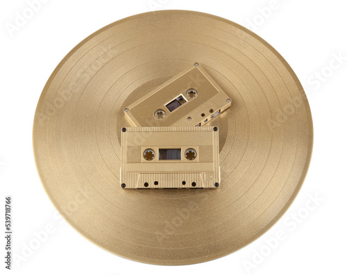 Vinyl record and cassette tape with recorded music photo