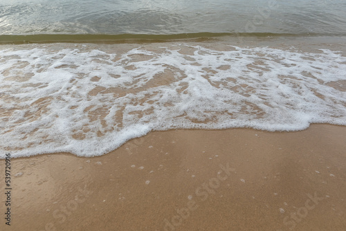 Beautiful beach with the smooth foam of sea in the morning of Rayong province Thailand