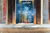 Smoke from incense sticks lit at a shrine in the ancient Jade Emperor's Pagoda in the city of Saigon.