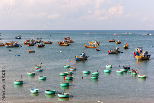 Fishing vessels in the waters off the coast of the town of Mui Ne in South Vietnam.
