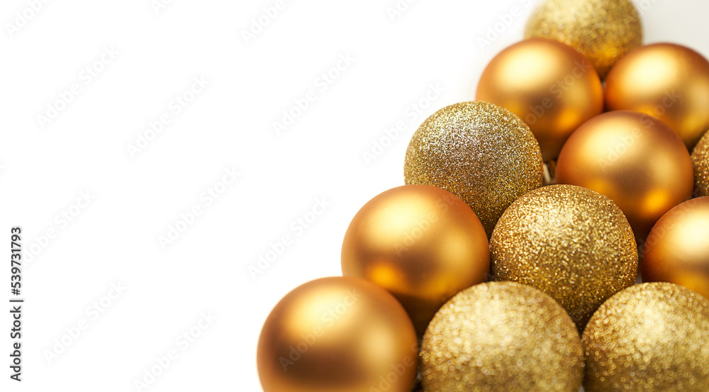golden christmas balls with triangle shape on a white background golden christmas balls with triangle shape on a white background