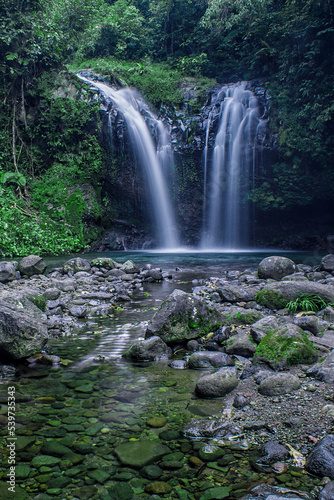 Fototapeta Naklejka Na Ścianę i Meble -  Beautiful view of twin waterfalls in the forest, Batu Blek Waterfall, Tasikmalaya, West Java, Indonesia