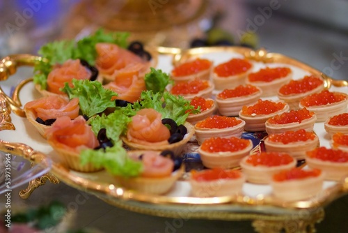 Delicious fish caviar canapes. Seafood in the diet. Decoration of the festive table.
