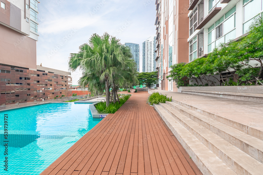 Pool swimming and garden in luxurious condominiums.