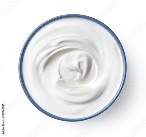 Blue ceramic bowl of fresh greek yogurt or sour cream