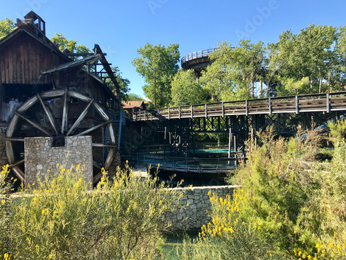 Salou, Spain, June 2019 - A house with bushes in front of a bridge