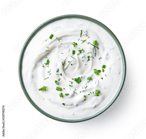 Green bowl of sour cream dip sauce with herbs Fototapet
