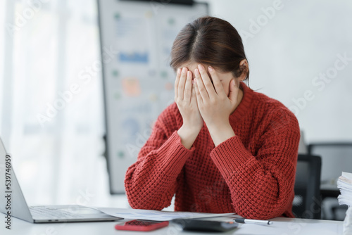 Confident business woman Sad and worried working with a laptop in an office ,hard work, overworked concept.