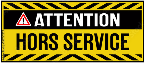 A sign that says in French language : attention - out of service